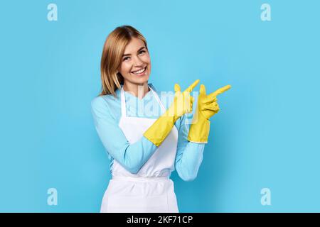 woman in gloves pointing fingers at copyspace Stock Photo