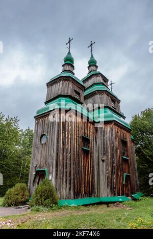 A vertical of an old wooden church n Pyrohovo museum of folk architecture in Kyiv, Ukraine. Stock Photo