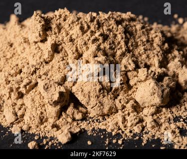 Fucus Vesiculosus Powder on black background Stock Photo