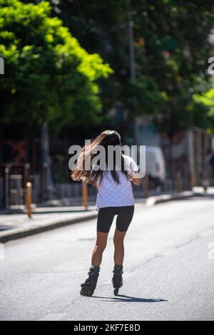 Person Riding Roler Skates Person riding roller skates outdoors, top view Stock Photo - Alamy