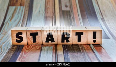 Start now alphabet letters on wooden background Stock Photo Alamy