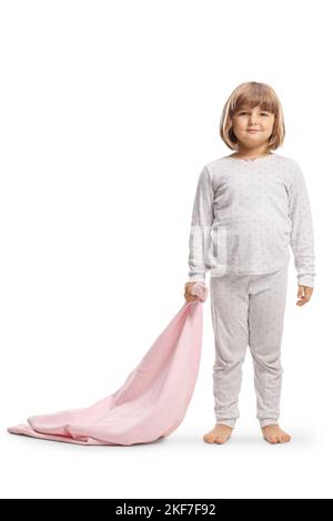 Full length portrait of a little girl in pajamas holding a pink blanket isolated on white background Stock Photo
