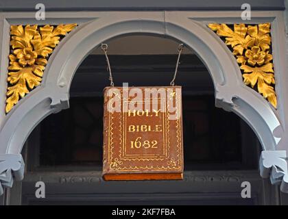 Oliver Bonas shop, 35 Stonegate, York, North Yorkshire, England, UK ,YO1 8AW - with holy bible 1682 hanging over entrance Stock Photo