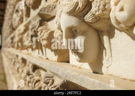 Ancient Mask Relief in Aphrodisias Ancient City in Geyre, Aydin, Turkiye Stock Photo