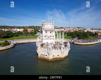 Aerial drone view of Belem Tower in Lisbon, Portugal during a beautiful sunny day next to the river Tagus. Unesco World Heritage. Historic visits. Stock Photo