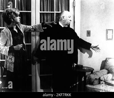 BARBARA HARRIS and Director ALFRED HITCHCOCK on set candid during filming of FAMILY PLOT 1976 director ALFRED HITCHCOCK novel Victor Canning screenplay Ernest Lehman music John Williams Alred J. Hitchcock Productions / Universal Pictures Stock Photo