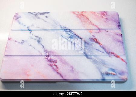 Decorative folding iPad Pro cover on a white background. Stock Photo
