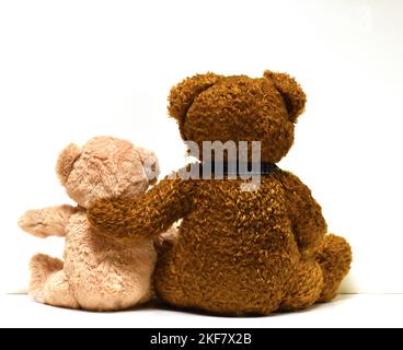 brown and tan stuffed teddy bears facing backwards Stock Photo