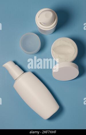 close up of mock up white jar with cream on a blue background  Stock Photo