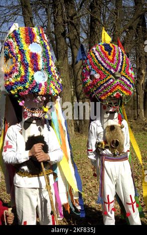 Branesti, Ilfov County, Romania, approx. 1999. Cucii- a spring pagan ritual in Southern Romania, where people wearing elaborate costumes walk through the villages to ward off evil and invite good Stock Photo