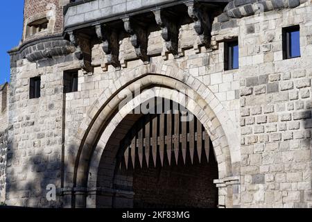portcullis with metal spikes on a medieval gate castle in cologne Stock Photo