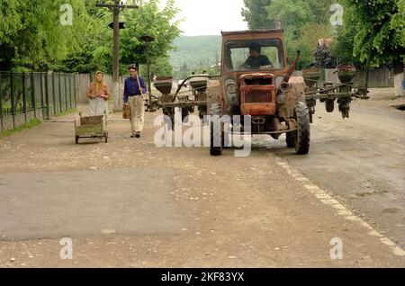 Prahova County, Romania, May 1990, a few months after the fall of communism. Local people on the main road of the village. Stock Photo