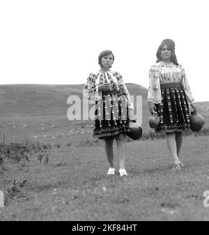 Teleorman County, Romania, approx. 1974.  Women wearing their beautiful traditional folk costumes. Stock Photo