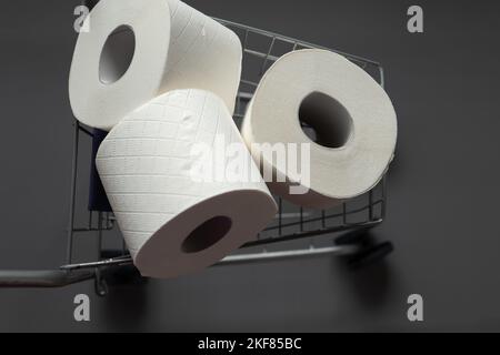 Toilet paper rolls in a supermarket trolley .Cleanliness and health.toilet paper shortage. View from above. Stock Photo