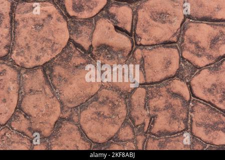 A red brown rock pattern with a rough abstract texture. Stock Photo