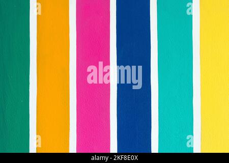 Multicolor vertical striped pattern on cement wall. Colorful painted on cement surface of the wall. Graffiti in the colors of rainbow. Colour full of Stock Photo