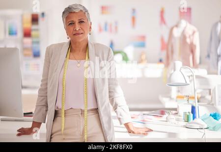 Fashion, designer and creative with portrait of business woman in workshop studio for tailor, management and textile industry. Factory, boutique and Stock Photo
