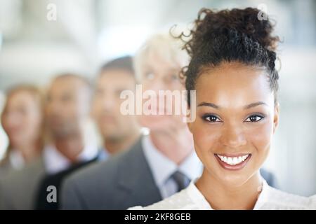 Theyre a team I can rely on. a group of diverse businesspeople standing in a line. Stock Photo