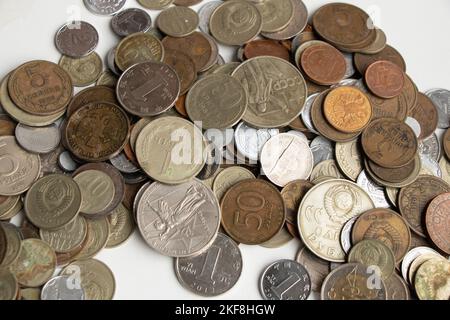 collection of coins from around the world at different times as a background Stock Photo