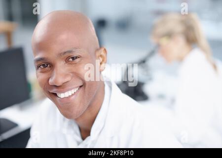 Ready for a long day in the lab. Closeup portrait of a smiling young scientist. Stock Photo