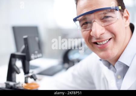 Positive about my research. Closeup of a scientist smiling at the camera. Stock Photo