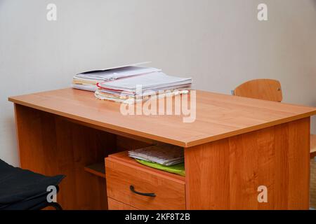 A stack of papers on a desktop without a computer Stock Photo