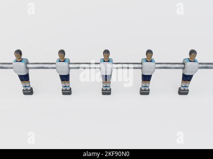 A single line of worn figurines from a vintage foosball or table football table styled in kit resembling the England national team - 3D render Stock Photo