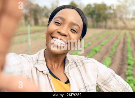 Agriculture, farm and selfie of happy black woman smiling and taking picture outdoors. Agro, sustainability and self portrait of female farmer for Stock Photo