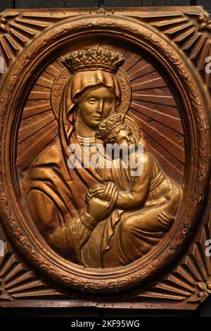 Icon of the Mother of God made of golden plastic, religion and faith in God, church Stock Photo