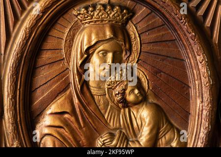 Icon of the Mother of God made of golden plastic, religion and faith in God, church Stock Photo