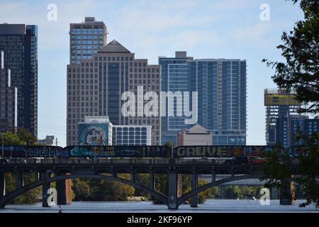 A mesmerizing shot of Ann W. Richards Congress Avenue Bridge  with graffiti from Lou Neff Point in Austin, US Stock Photo