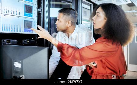 Server room, team and repair of computer hardware for cloud computing, cloud and cyber security. Database, datacenter and software engineers fixing Stock Photo