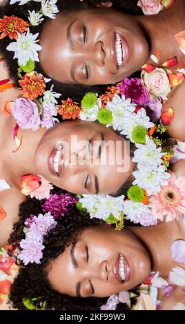 Black women, flowers and skincare wellness of diversity, cosmetic and facial health with plants. Black woman top view with cosmetics, body care and Stock Photo