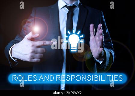 Text sign showing Roles And Responsibilities. Business approach Business functions and professional duties Stock Photo