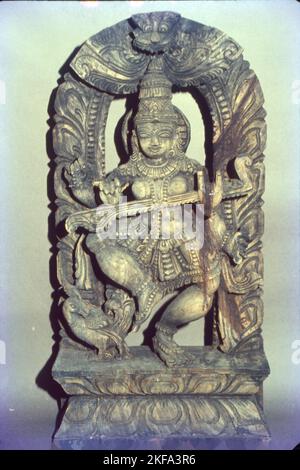 Goddess Saraswati Idol in Wood, India Stock Photo