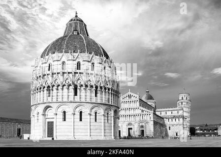 Black and white photo showing the Baptistery and other historic monuments at miracles square in Pisa Stock Photo