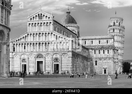 Black and white photo showing in perpesctive historic monuments at miracles square in Pisa Stock Photo