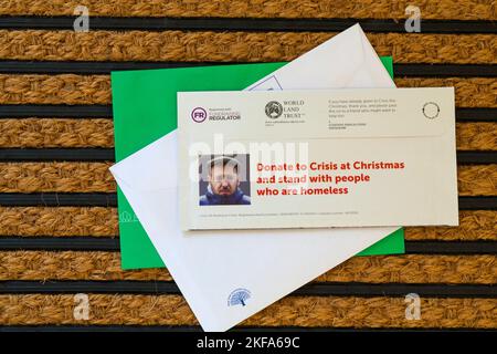 Post mail on doormat - charity appeal from Crisis, Donate to Crisis at Christmas and stand with people who are homeless Stock Photo
