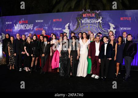 HOLLYWOOD, LOS ANGELES, CALIFORNIA, USA - NOVEMBER 16: Shelly Gillyard, Marian Lee, Peter Friedlander, Steve Stark, Ted Sarandos, Rachel Horwitz, Johnna Dias Watson, Kayla Alpert, Gwendoline Christie, Oliver Watson, Moosa Mostafa, Arturo Interian, Emma Myers, Jamie McShane, Joy Sunday, Christina Ricci, Hunter Doohan, Jenna Ortega, Georgie Farmer, Catherine Zeta-Jones, Victor Dorobantu, Riki Lindhome, Luis Guzman, Al Gough, Isaac Ordonez, Percy Hynes White, Naomi Ogawa, Coral Wright, Miles Millar and Teddy Biaselli arrive at the World Premiere Of Netflix's 'Wednesday' Season 1 held at the Holly Stock Photo