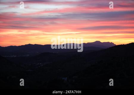 Sunset.Sunset from Los Rosales near Frailes ,Jaen, Andalusia, Spain. Clouds and setting sun creating patterns and colour as if on fire.Andalusian sky. Stock Photo