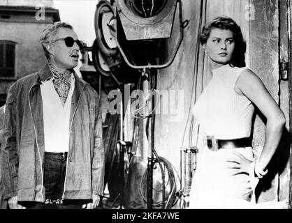 VITTORIO DE SICA and SOPHIA LOREN on set location candid during filming of TOO BAD SHE'S BAD / PECCATO CHE SIA UNA CANAGLIA 1954 director ALESSANDRO BLASETTI story Alberto Moravia music Alessandro Cicognini costume design Maria De Matteis Documento Film Stock Photo