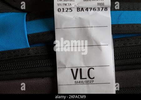 BA British Airways luggage label stuck on luggage for VLC Valencia airport in Spain Stock Photo