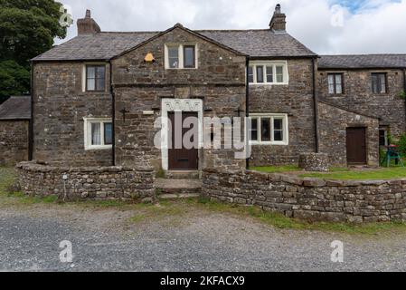 Gisburn Forest. Forest of Bowland, Clitheroe, Lancashire United Kingdom. Stephen's Park building. Stone property with brown wooden door. Stock Photo