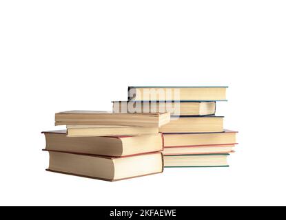 Stacks of books in hard and soft covers on a white background. Copy space. Stock Photo