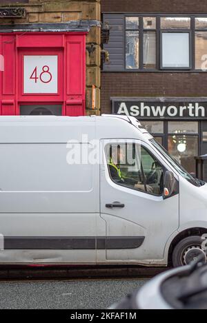 Man driving white van concentrating on the road. Burnley Lancashire Stock Photo
