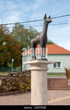 Modern, Bronze  statue of a deer in front of the Heart of Jesus church, Heviz, Hungary Hévíz is a spa town in Zala County, Hungary, Stock Photo