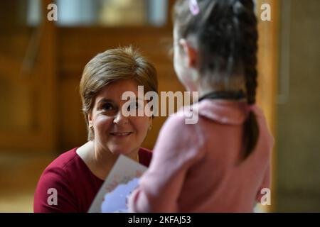 Edinburgh, Scotland, UK. 17 November 2022. PICTURED: Ava, 6, who is celebrating her 6th birthday today seen meeting seen meeting Nicola Sturgeon MSP, First Minister of Scotland and Leader of the Scottish National Party (SNP). Ava wanted to come and meet the First Minister again after she last saw the First Minister during the council elections in Kirkcaldy spending the afternoon with her during campaigning. Scenes inside the weekly session of First Ministers Questions inside the Scottish Parliament at Holyrood. Scenes showing before, during and after FMQs. Credit: Colin D Fisher Stock Photo