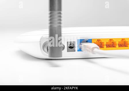 White Wi-Fi router for connecting devices to the Internet. Stock Photo