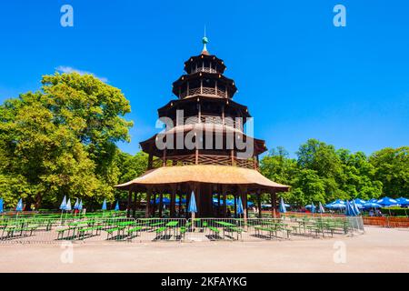 Munich, Germany - July 06, 2021: Chinese Tower or Chinesischer Turm is a 25 metre high wooden tower in the English Garden or Englischer Garten, a publ Stock Photo