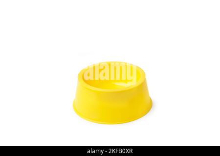 Empty yellow dog food bowl on a white background with coppy space Stock Photo